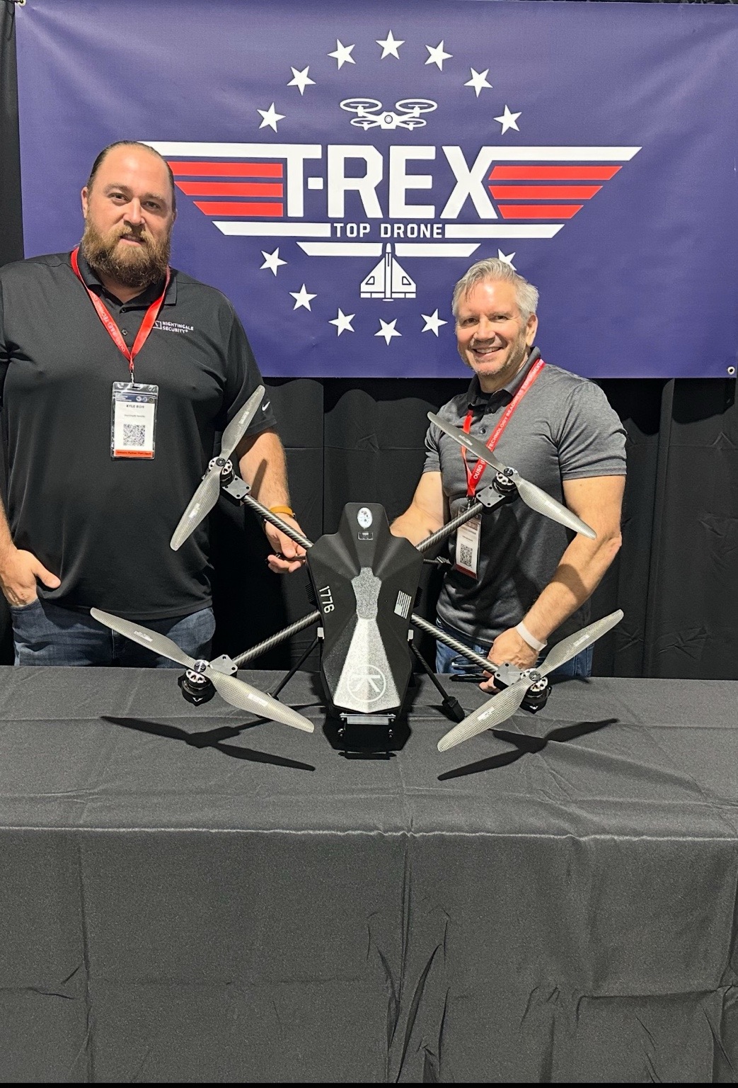 Darren Hannam with Nightingale Security Blackbird autonomous security drone at the T-REX event supporting Department of War UAS missions and critical infrastructure protection.